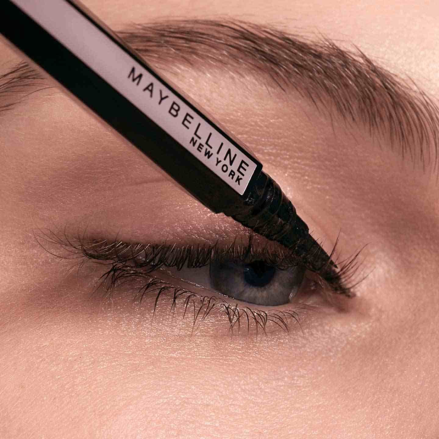 Liquid eyeliner applied to the upper lash line starting at the inner corner.