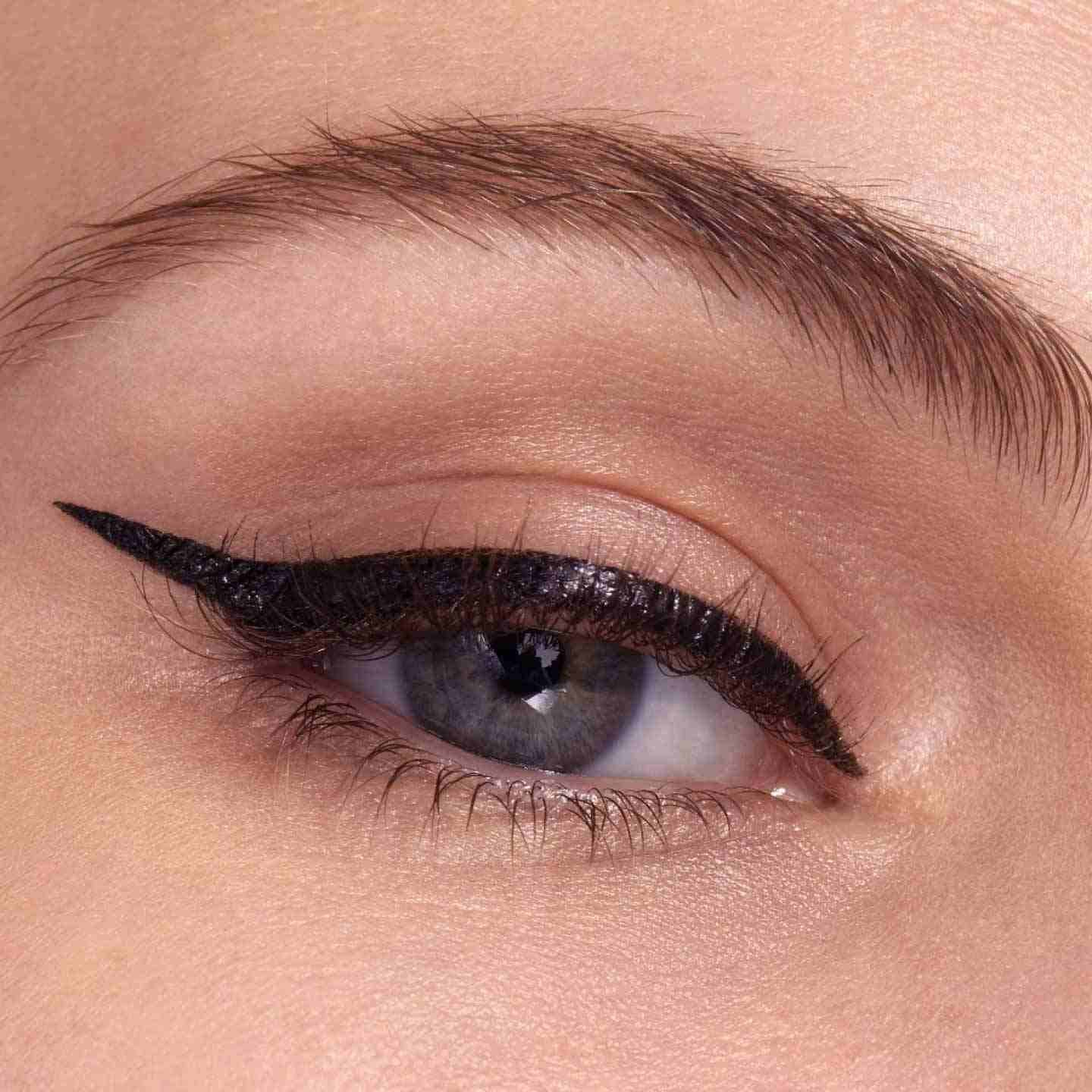 Finished winged eyeliner look created with black liquid eyeliner by Maybelline.