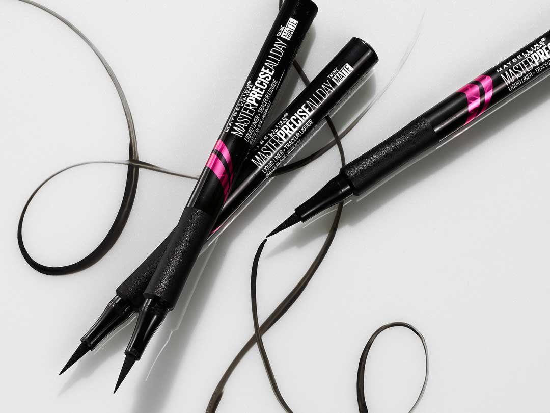 Product laydown shot of Maybellines sweat-proof eyeliner, Master Precise All Day Liquid Eyeliner.