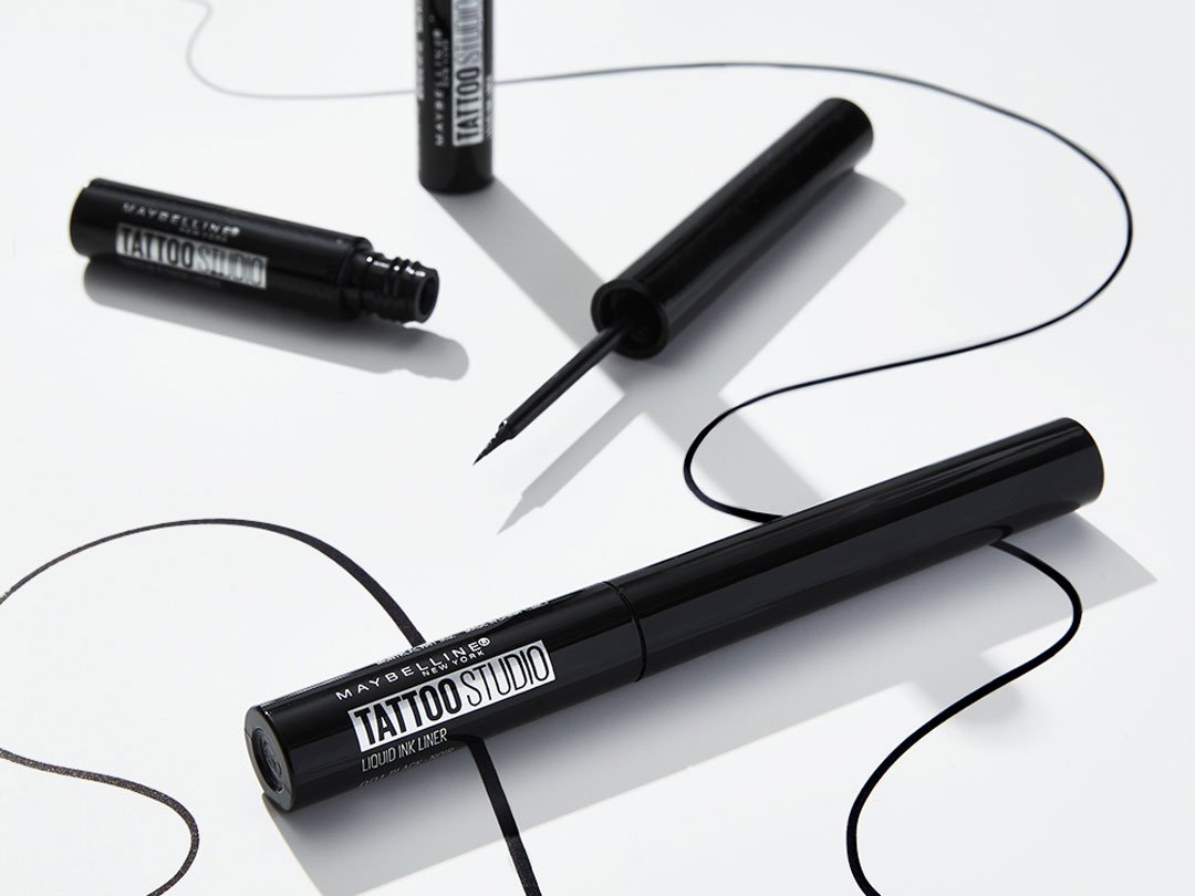 Product laydown shot of Maybellines sweat-proof eyeliner, Tattoostudio Liquid Eyeliner.