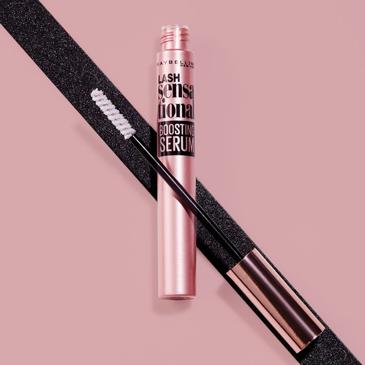 Product lay down shot of Maybellines eyelash serum, Lash Sensational Boosting Eyelash Serum. 