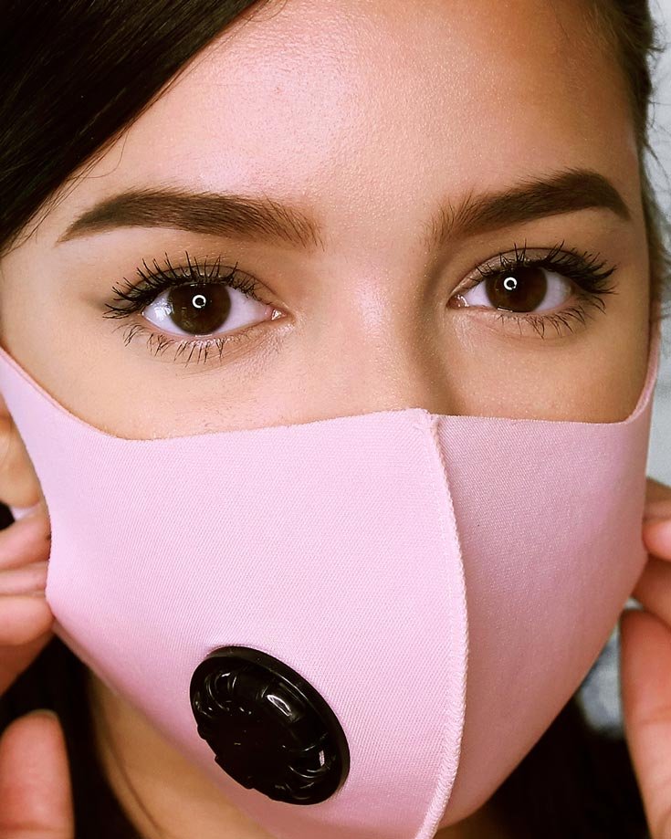 Model wears face mask with transfer proof makeup by Maybelline.