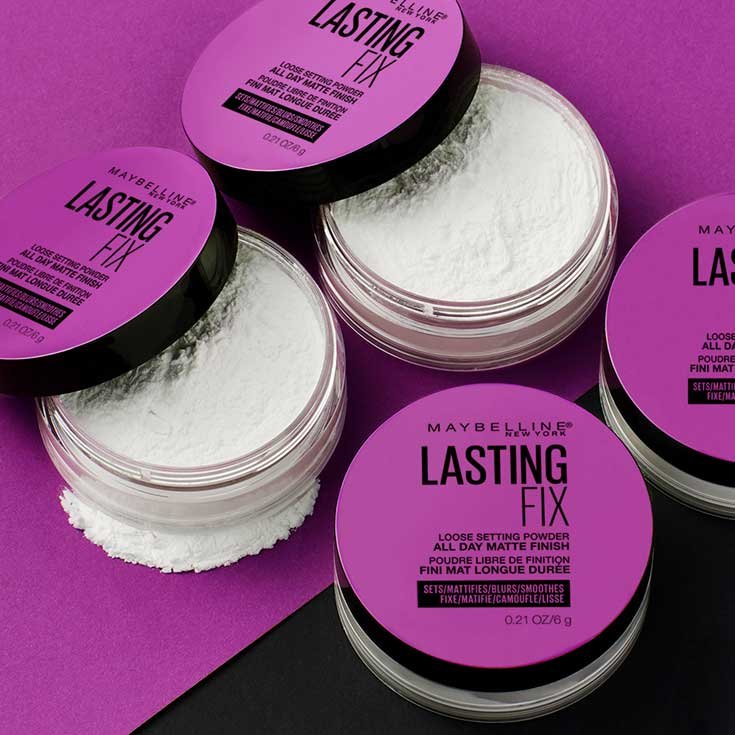 Product laydown shot of Lasting Fix Setting and Perfecting Loose Powder by Maybelline New York.